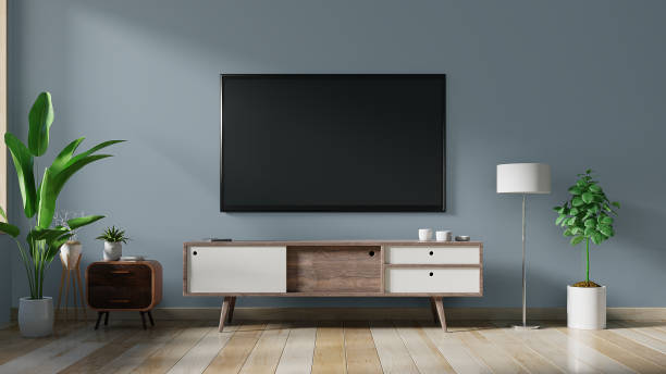 istock Smart TV on the dark blue wall in living room,minimal design. 1175615105