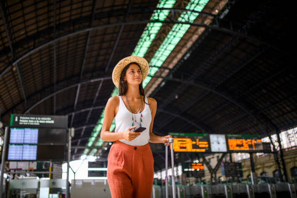 istock Woman at the train station. 1175619092