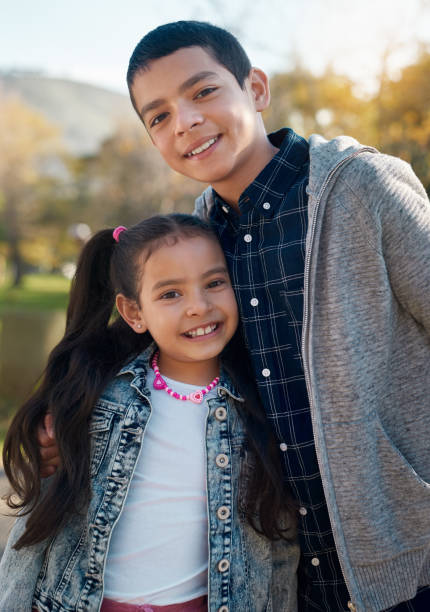 Shot of an adorable brother and sister having a fun day at the park