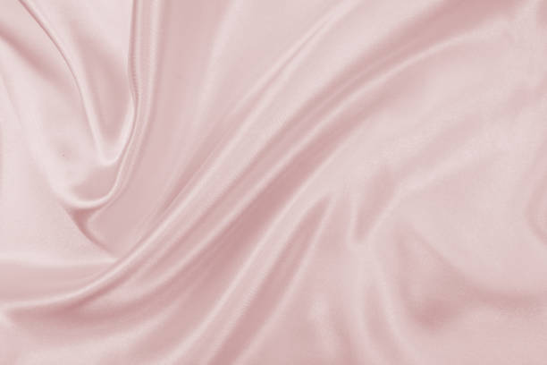 istock Delicate satin draped fabric pink texture for festive backgrounds 1175624941