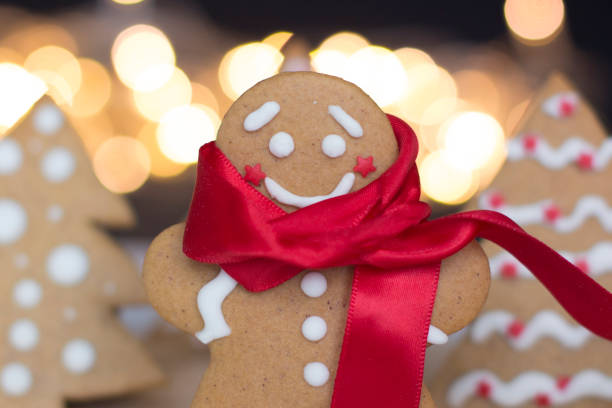 istock gingerbread man cookie in a red scarf 1175634103