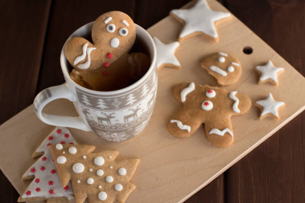 gingerbread man cookie in a cup with hot chocolate