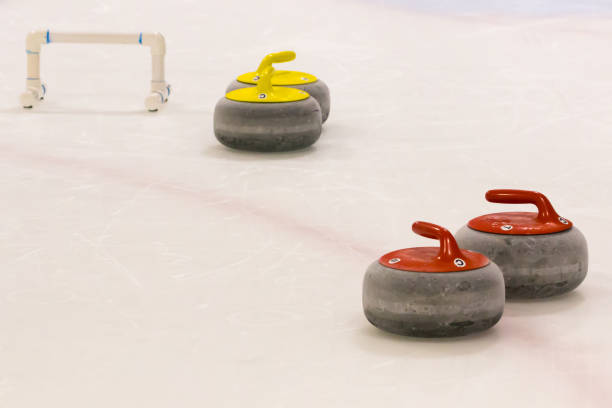 istock Red and Yellow Curling Stones with Stabilizer Bar 1175634318