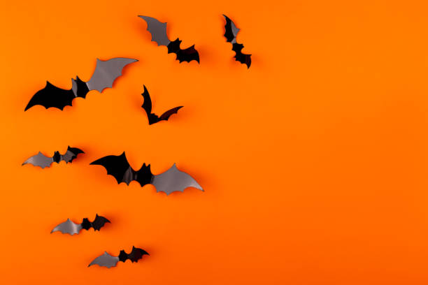 istock Halloween background made with paper bats on white. 1175638561