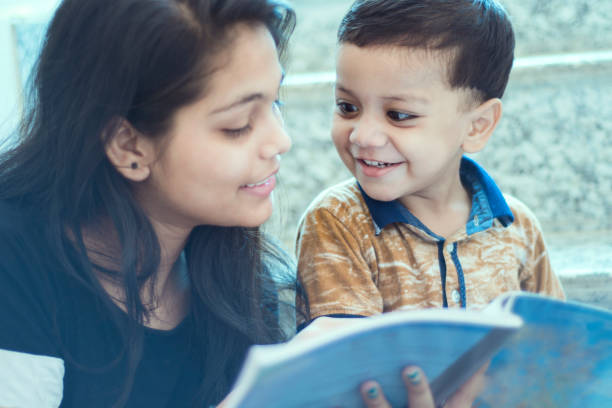 istock A girl teaching a small child 1175640774