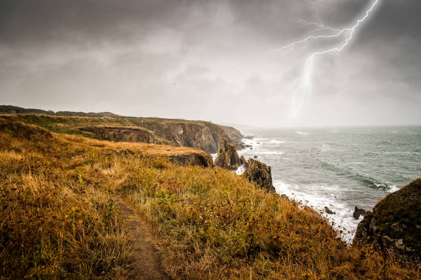 Lightning bolt strike from a thunderstorm near the cliffs of Pointe Saint Mathieu, Brittany, France