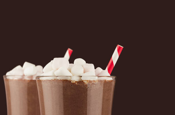 elegant hot chocolate with marshmallows and red striped straw closeup, details, top section on dark brown background, copy space. - hot chocolate hot drink high section close up imagens e fotografias de stock