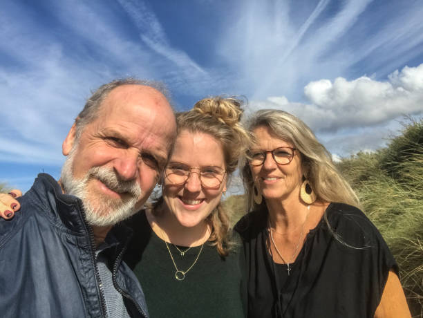 istock Family Beach walk 1175647418