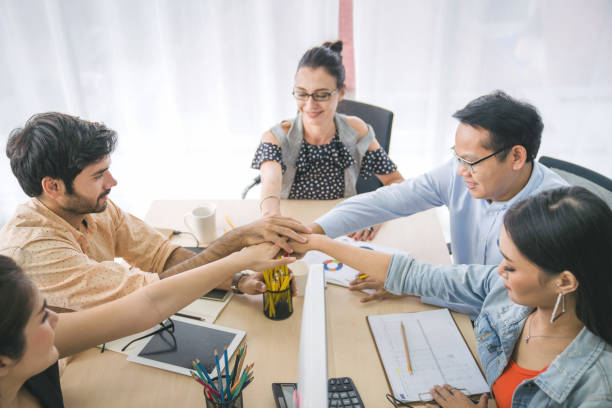 istock Fin-tech and technology concept Young Portrait creative couple working success project with Business partner and wearing  casual outfit working happy action in modern Coworking space 1175647989