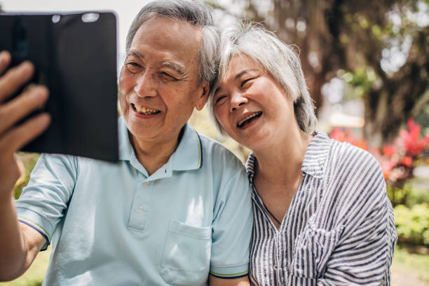istock Beautiful senior couple using phone 1175648996