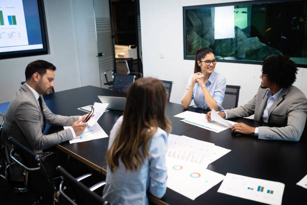 istock Group of successful business people at work in office 1175649073
