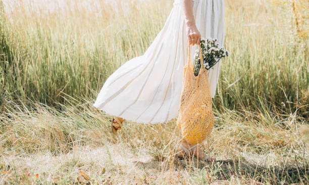 istock woman natural clothes eco mesh string bag wildflowers 1175649661