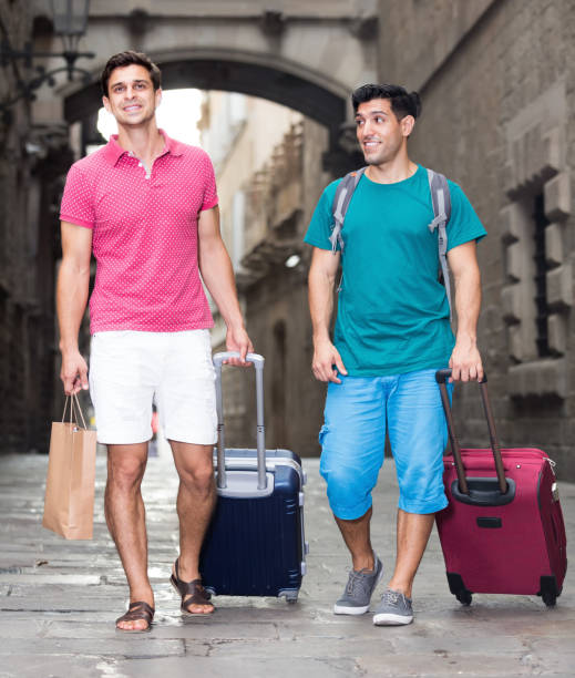 istock Two men friends walking together with baggage 1175650767