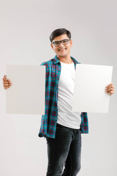istock Indian/Asian Young Man showing blank signboard on White background 1175650814