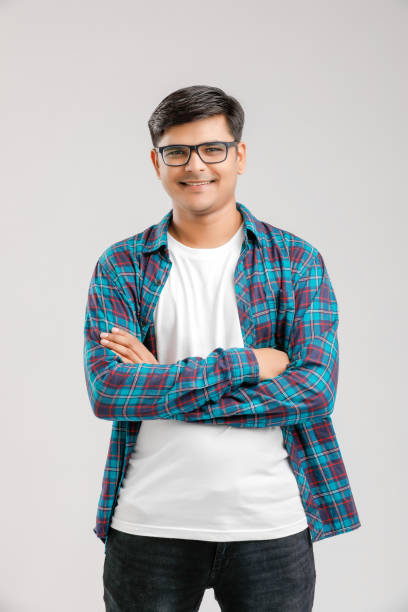 Happy young Indian man over white background