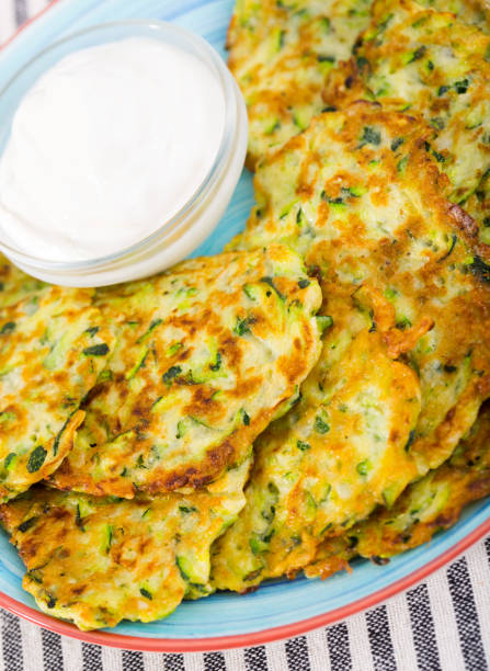 istock Cooked tasty pancakes with white sauce at white plate 1175652929