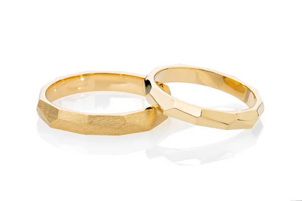 istock Pair of gold geometric wedding rings isolated on white background 1175652947