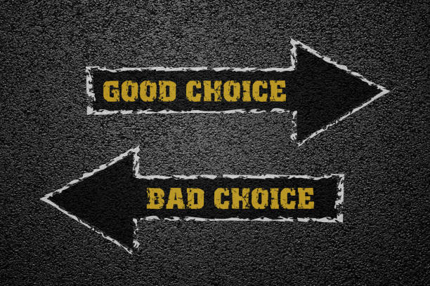 Good and bad choice concept on asphalt ground