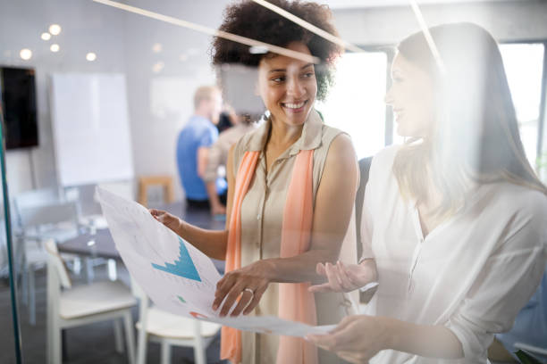istock Team of colleagues brainstorming together while working in modern office 1175657948