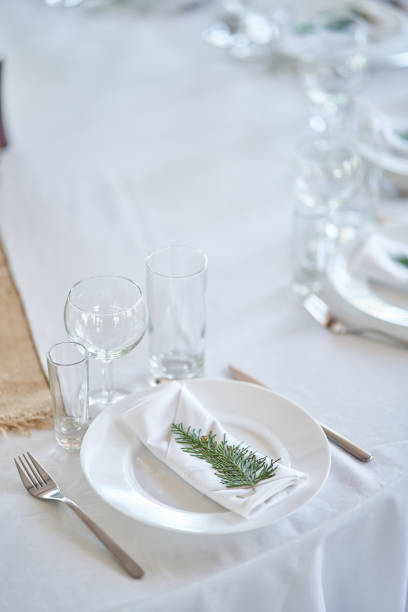 istock Wedding decorations. White plates on a white tablecloth. Natural style wedding 1175658963