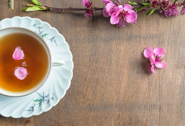 istock Tea time concept with peach flowers 1175659555
