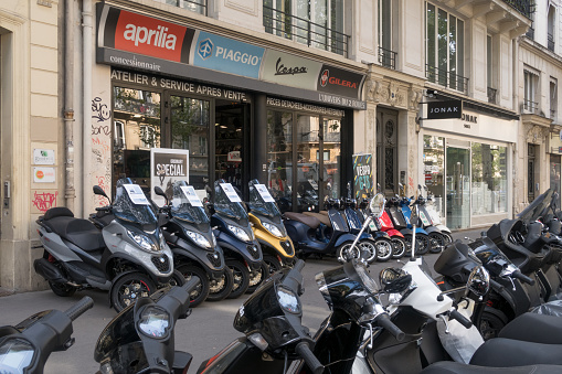 Paris, France - Aug 31, 2019: Motorbike Shop in Paris France. Aprilia, Piaggio, Vespa, Gilera dealership in Central Paris, France,