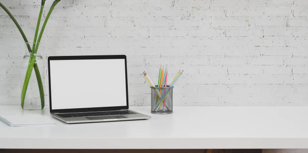 istock Minimal designer workplace with laptop computer and office supplies 1175664330