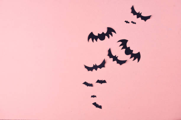 istock Halloween party content. Black bats of different sizes on a plain background. 1175665151