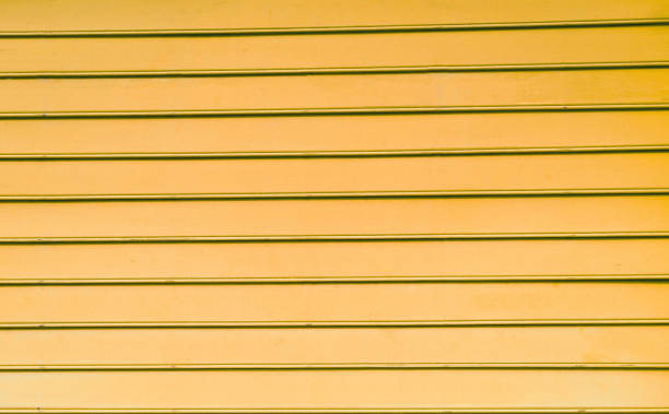istock Pastel  wood background texture with horizontal parallel boards color yellow 1175666292