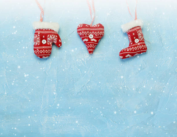 istock Christmas decorations hanging on a blue background. 1175667100
