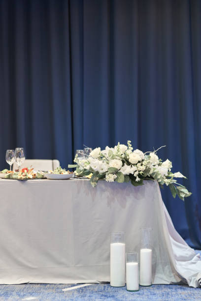 istock Wedding decor with white flowers and candles. Table decoration. Wedding celebration. 1175667210