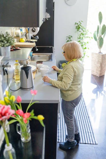 istock Senior woman preparing coffee 1175668294