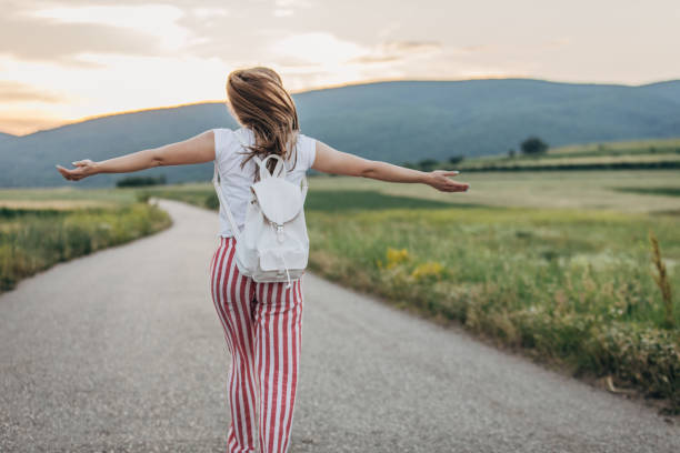istock Woman with hands raised in the nature 1175671228