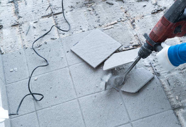 istock construction worker using a handheld demolition hammer and wall breaker to chip away and remove old floor tiles during renovation work 1175672841
