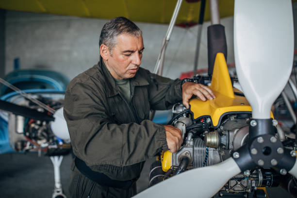 istock Airplane mechanic repairing airplane 1175673568