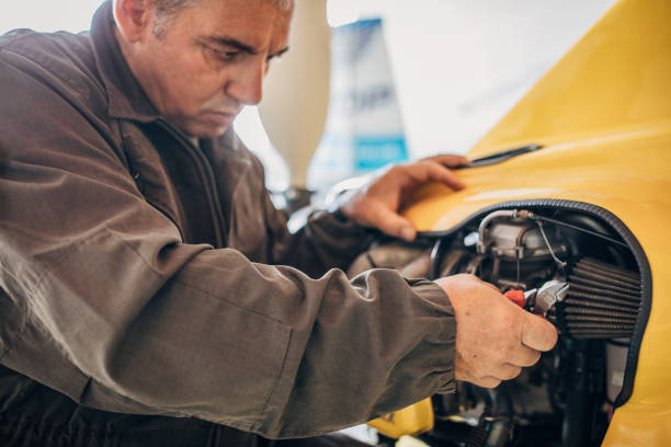 istock Airplane mechanic repairing airplane 1175673627