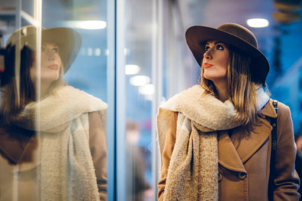 istock Beautiful woman window shopping 1175674170