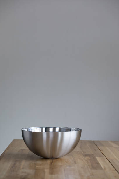 istock Empty metal salad bowl on the table. 1175675984