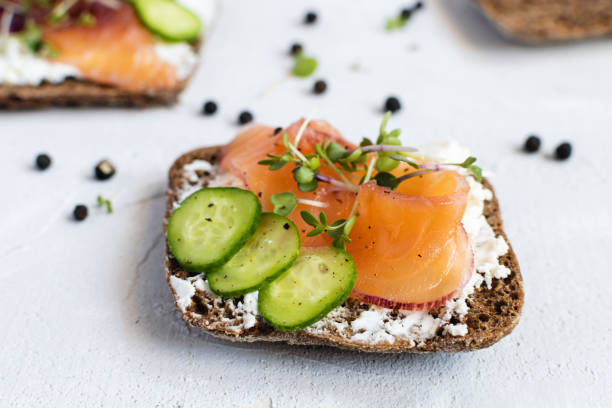 istock Rye bread, smoked salmon, cucumber and microgreens 1175676089