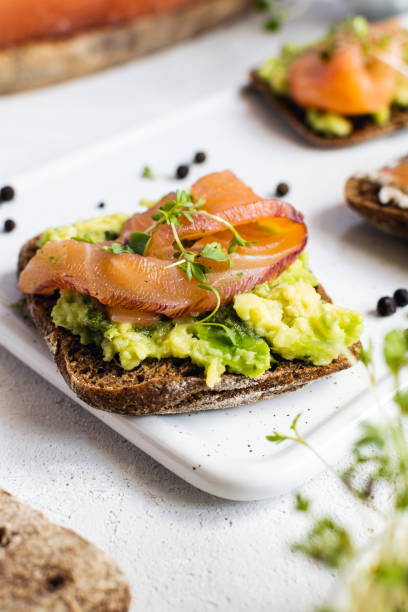 istock Rye bread, smoked salmon, cucumber and microgreens 1175676309