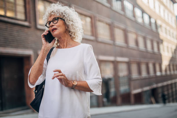 istock Senior woman using phone 1175676408