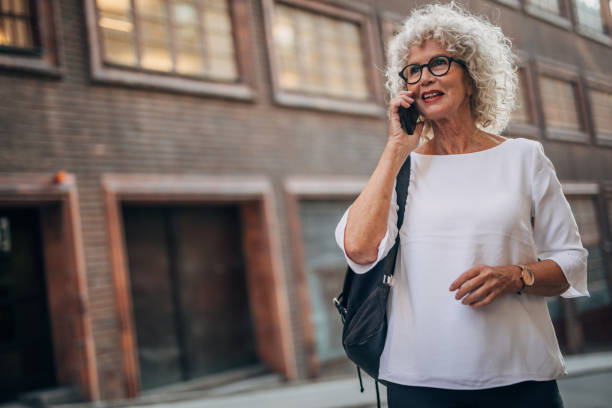 istock Senior woman using phone 1175676484