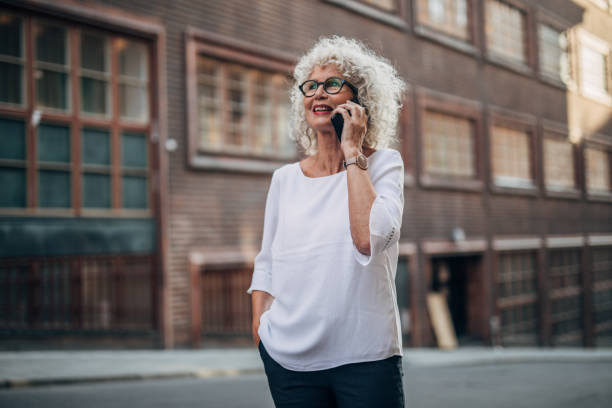 istock Senior woman using phone 1175676566