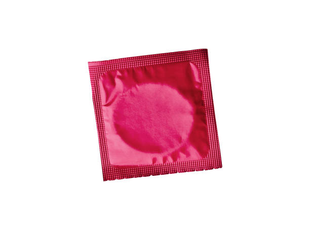 Red condom isolated Red condom isolated condom photos stock pictures, royalty-free photos & images