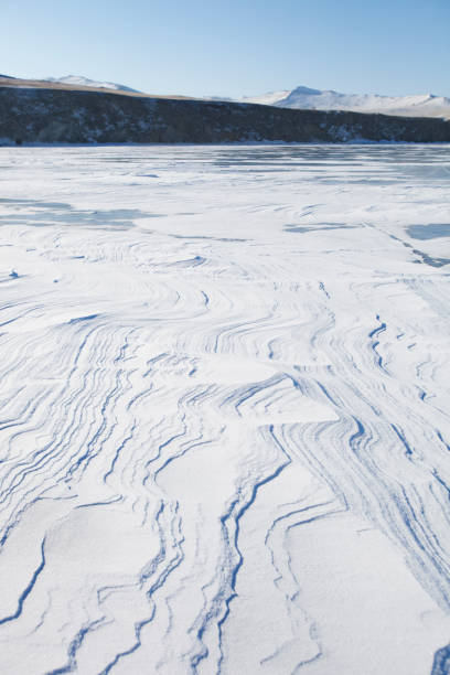 istock Lake Baikal winter landscape. Wavy snow 1175676954