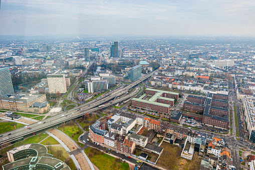 aerial view on the suburbs of Dusseldorf, smoke from coal-fired power stations in the background