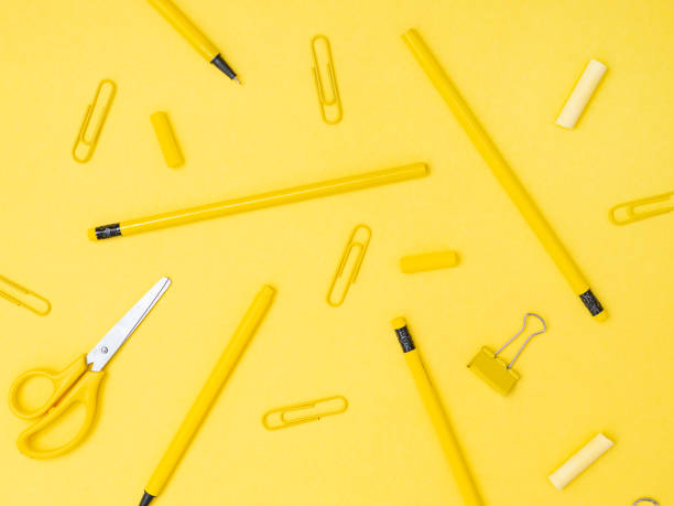 istock School tools, stationery accessories isolated on yellow background 1175679916