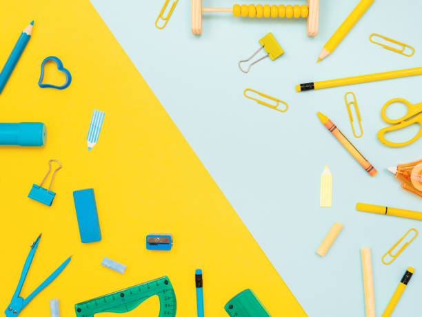 istock Blue stationery tools and yellow school tools isolated on dual color yellow and blue studio background 1175679944