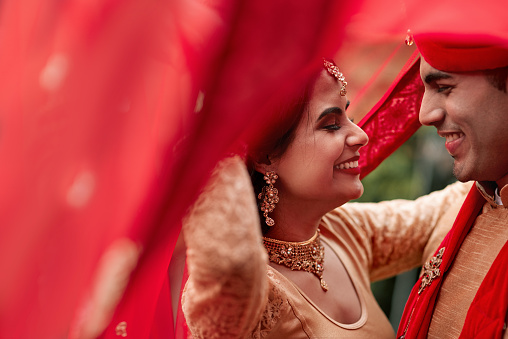 Cropped shot of a young hindu couple on their wedding day