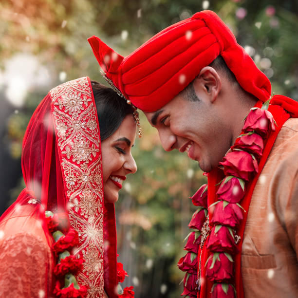 Here's to love and happily ever after Cropped shot of a young hindu couple on their wedding day wedding dress photos stock pictures, royalty-free photos & images